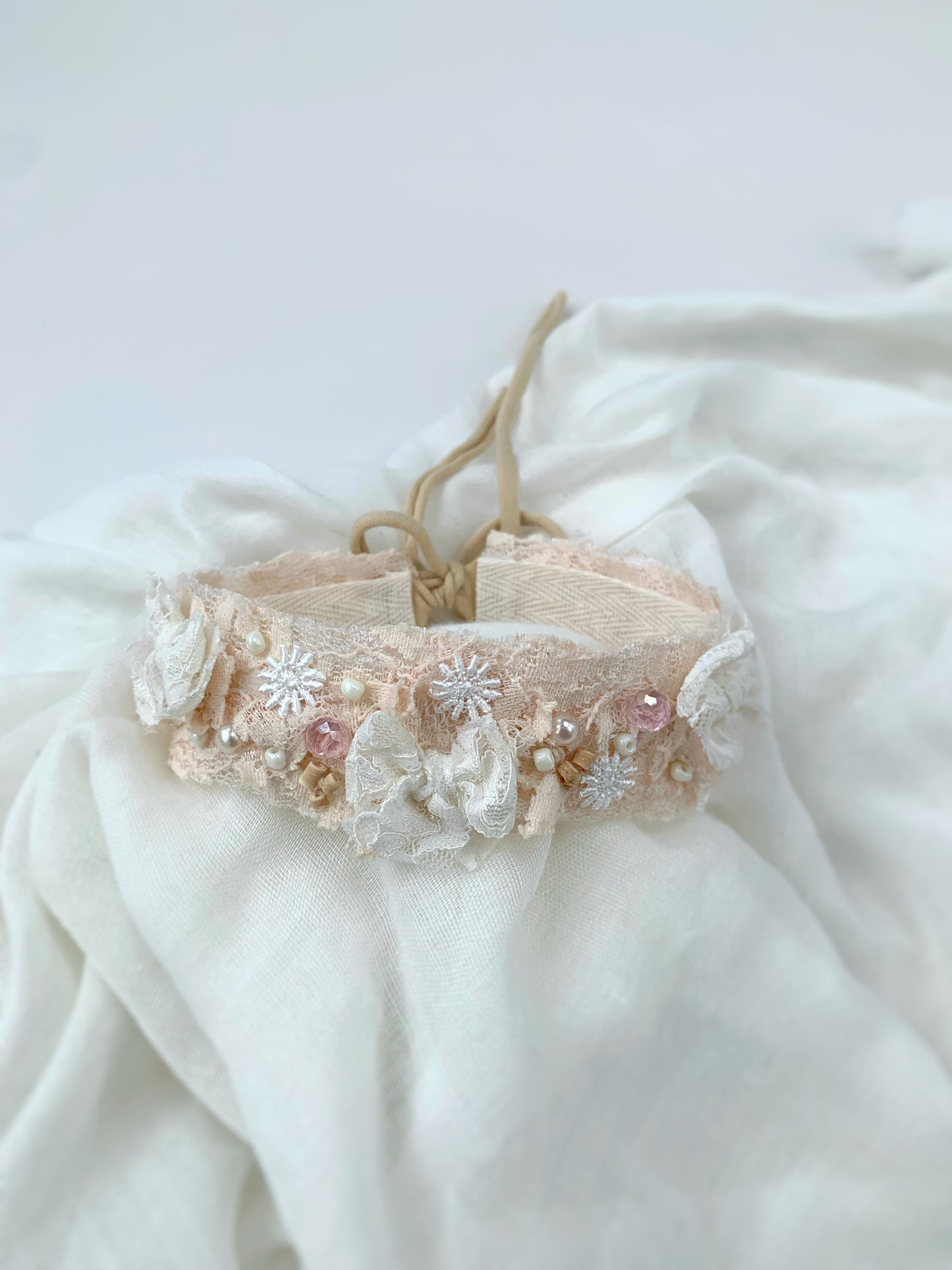delicate floral embroidered baby bow headband in white and blush pink