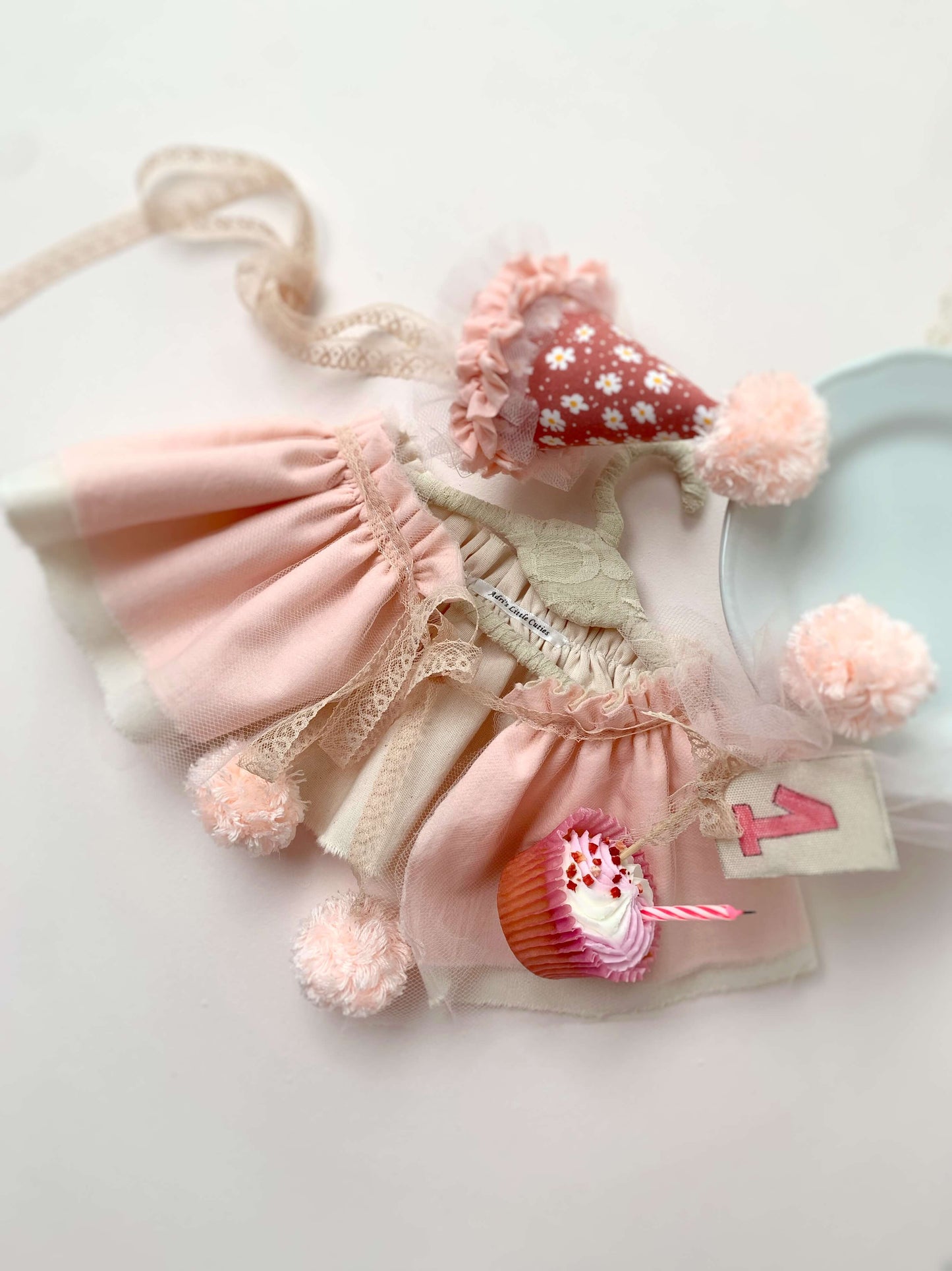 Handmade baby girl party hat with frilly trim and ruffled collar to match