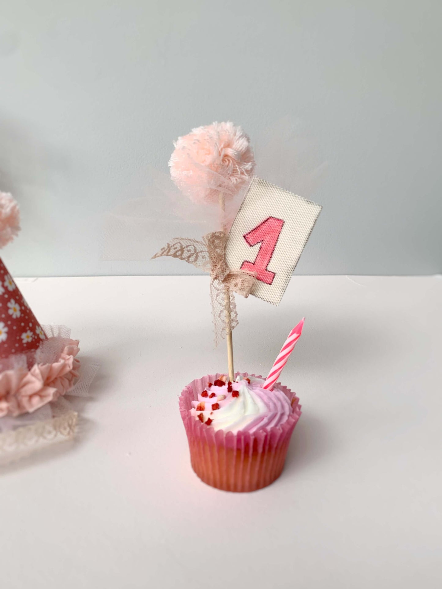 cake topper with pompom and number 1