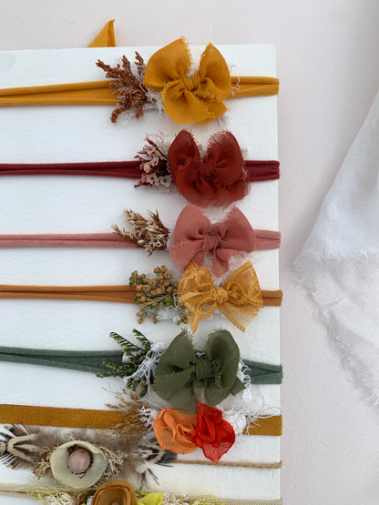 close up of the baby bow headbands in different colours to choose from