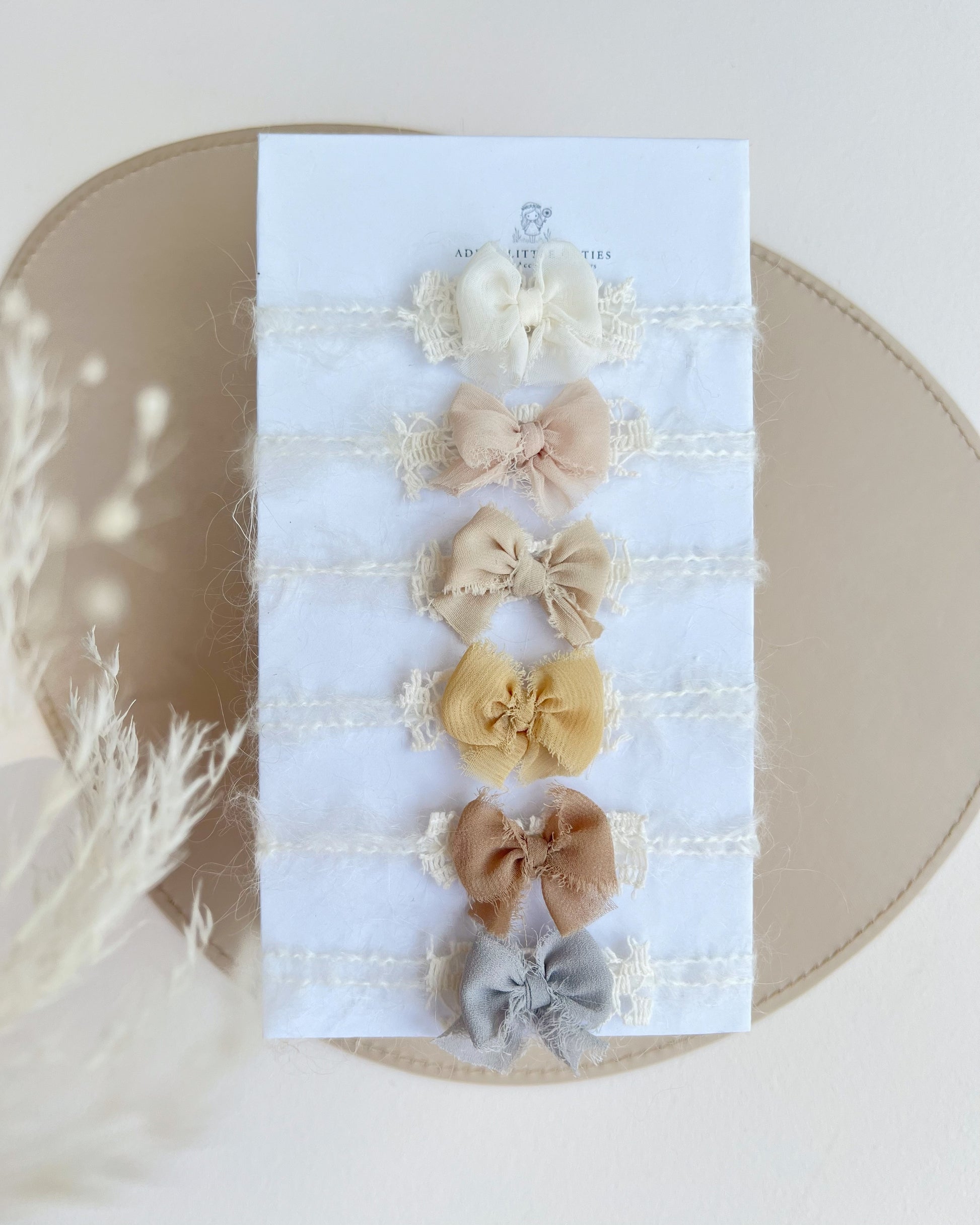 Set of 6 delicate muted newborn photography bows