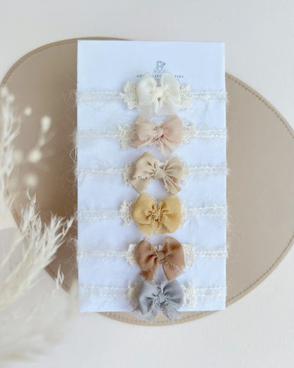 Set of 6 delicate muted newborn photography bows