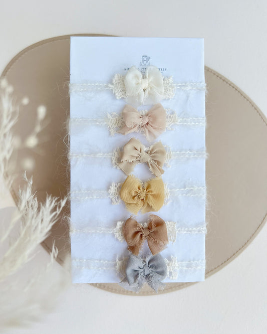 Set of 6 delicate muted newborn photography bows