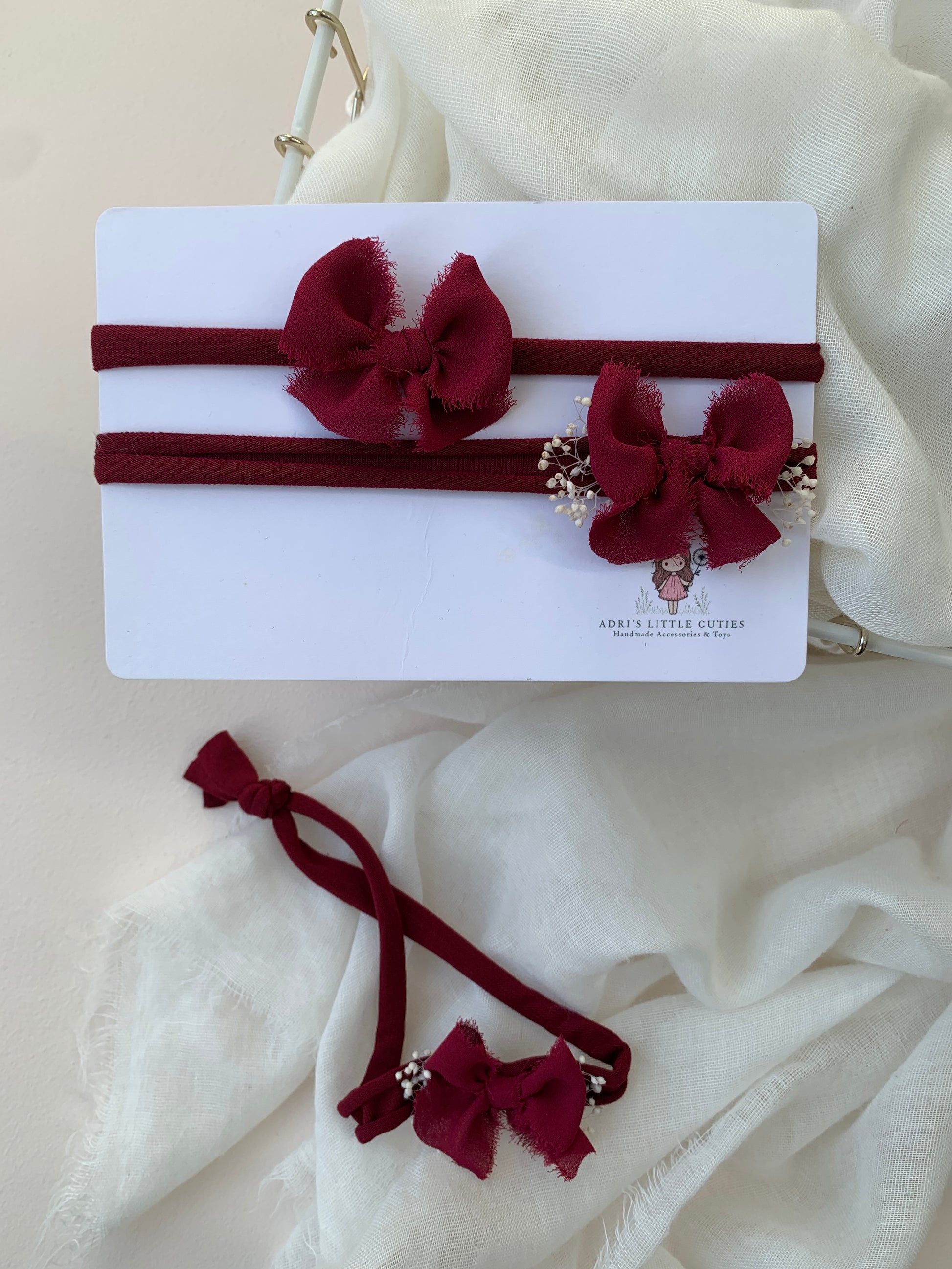 Delicate red baby bow headband for newborn photos